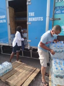 Mount Pure Natural Mineral Water - Rolanda McQueen helps unload truck